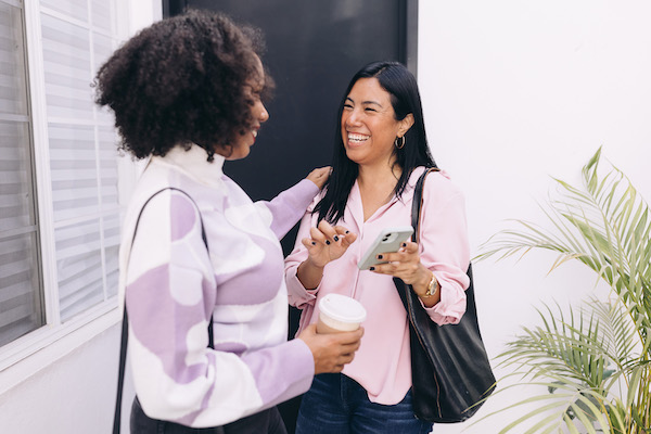 Two doulas sharing referral information and networking.