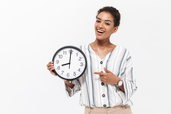 A woman holding a clock