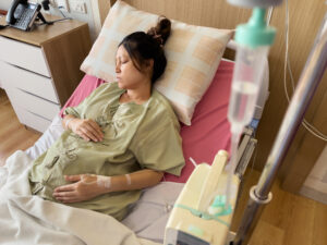 pregnant woman patient is sleeping on a bed in hospital