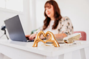 Doula sits at her desk reading an agency contract.