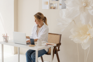A woman sits at her desk working