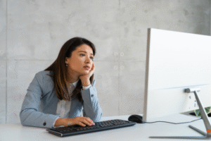Doula looking bored at their desk