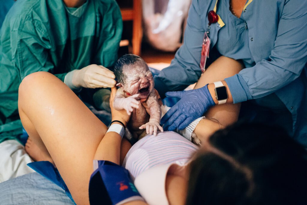 A baby is born in a hospital.