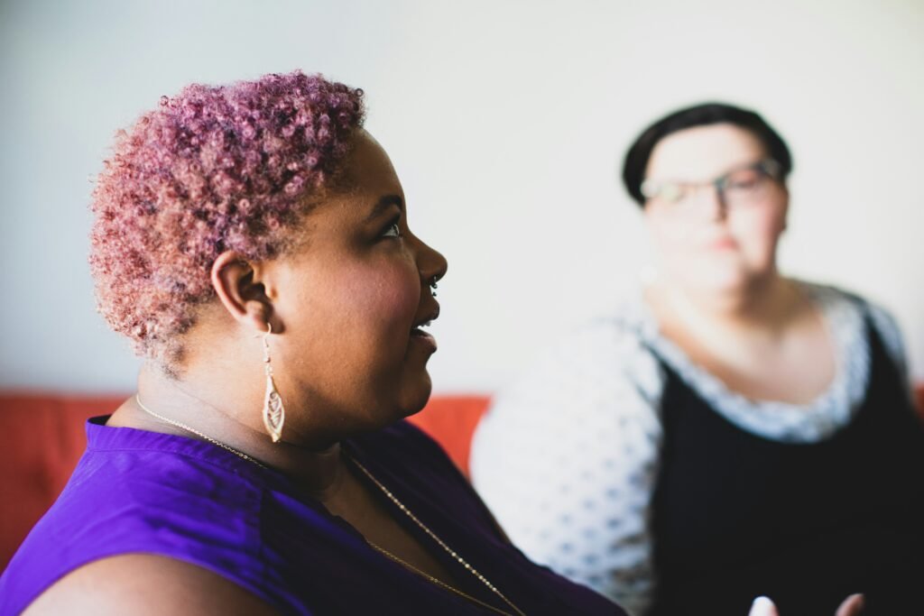 Two women talking.