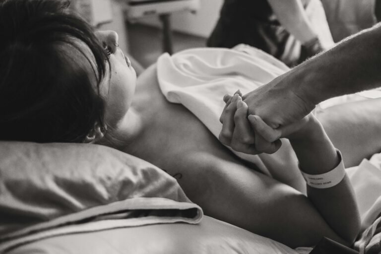 Doula holding hands.