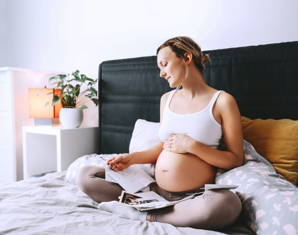 Pregnant woman looking at insurance