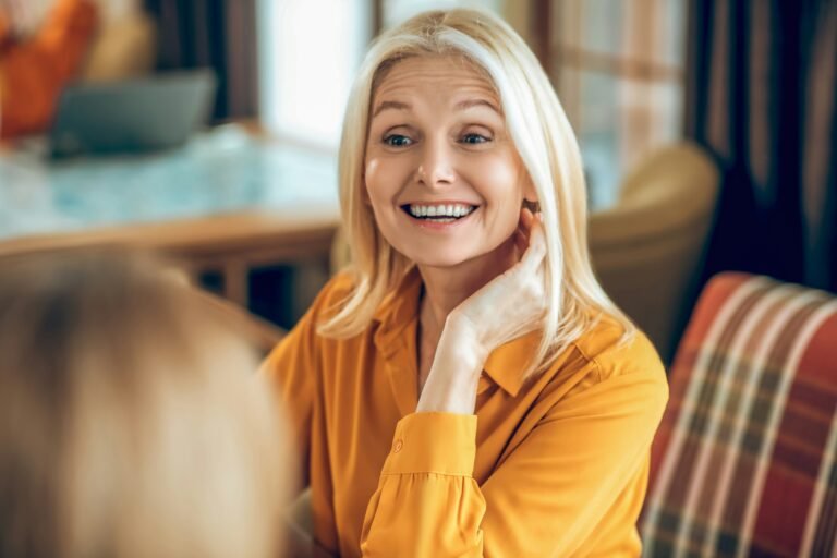 A doula smiles during an interview.